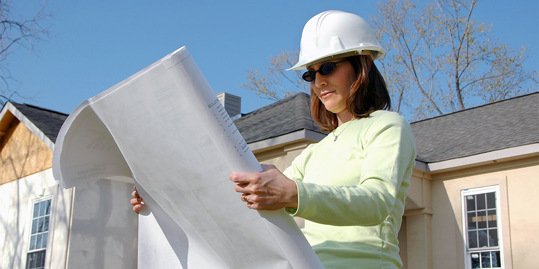 Contractor reviewing house plans